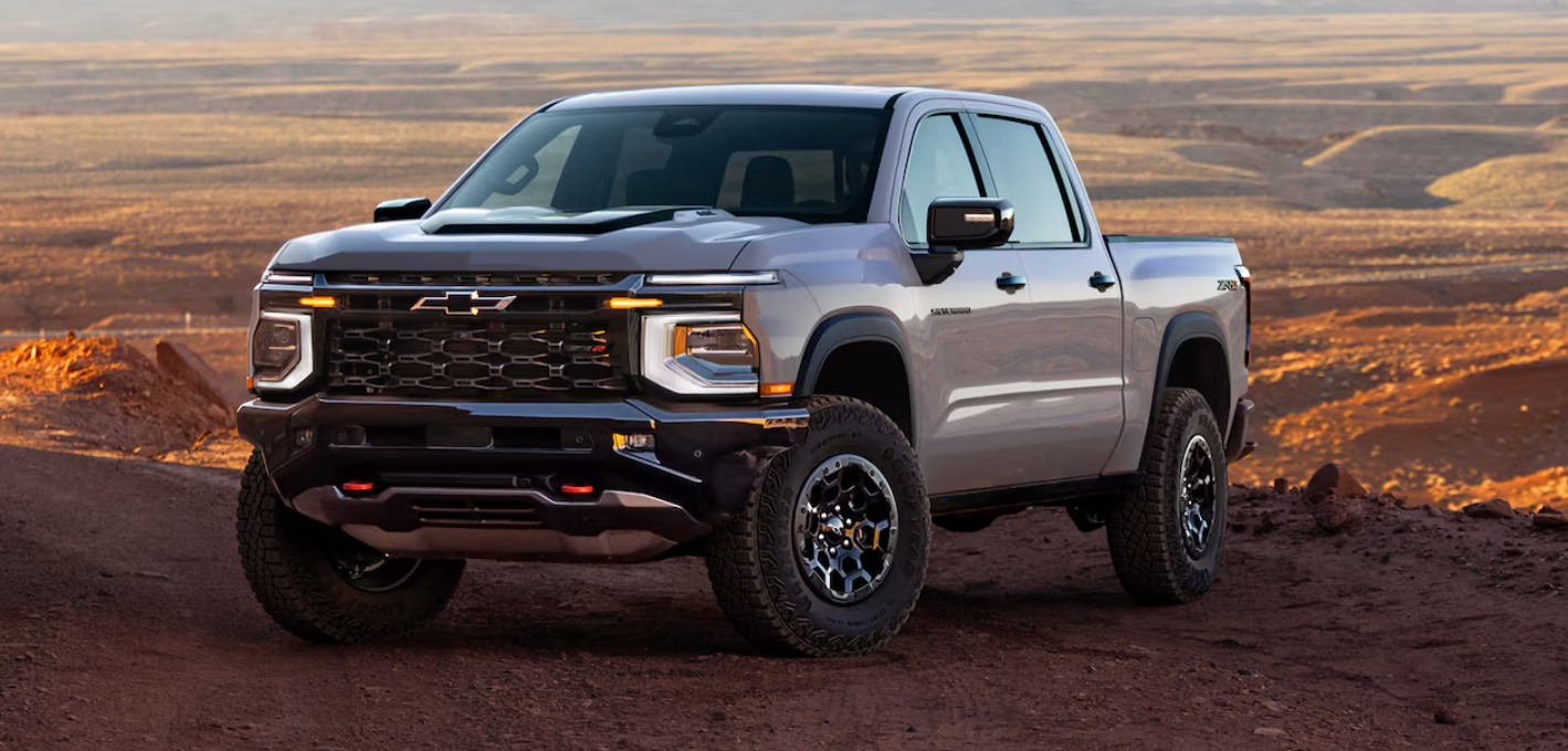 A silver 2027 Chevrolet Silverado 1500 on a dirt road