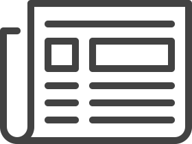 A customer is proudly displaying the key to their car in the showroom