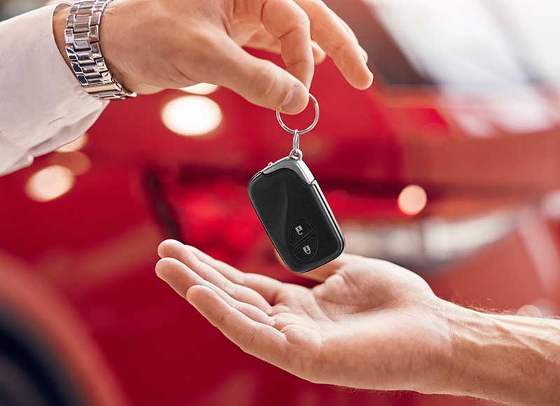 person giving car key